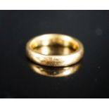 A 22ct. yellow gold wedding band, size L, 6.4 grams.