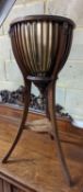 An Edwardian style inlaid mahogany jardiniere, height 85cm