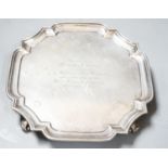 A George V silver shaped square waiter, with engraved inscription, Goldsmiths & Silversmiths Co Ltd,