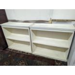 A pair of modern white painted dwarf open bookcases, length 90cm, depth 30cm, height 82cm