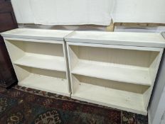 A pair of modern white painted dwarf open bookcases, length 90cm, depth 30cm, height 82cm