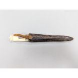 An antique Norwegian marine ivory hunting knife, with carved and pierced scabbard and leather