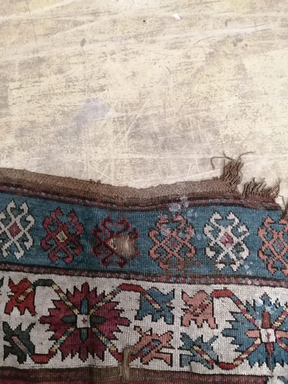 An antique Kazak rug, 310 x 150cm - Image 7 of 7