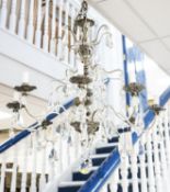 A silvered and crystal eight branch chandelier, approx. height 79cm