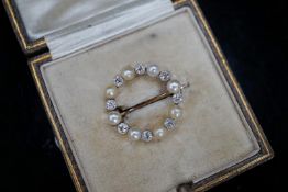 An Edwardian yellow metal, diamond and seed pearl set open work circular brooch, 20mm, gross 2.9