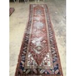 † An antique Heriz runner, 362 x 95cmThe property of Bath and Racquets Club