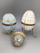 Two silver gilt mounted enamelled eggs with interior seascapes, on silver gilt stands, Birmingham,