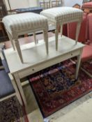 A rectangular painted dressing table, width 110cm, depth 60cm, height 75cm, together with two