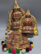 A group of Indian ornate wooden headdresses, masks etc