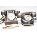 Two vintage telephones and 1950's colour-printed tablecloth