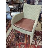 Vincent Sheppard, a set of four conservatory chairs with tan leather seats