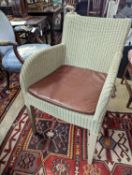 Vincent Sheppard, a set of four conservatory chairs with tan leather seats