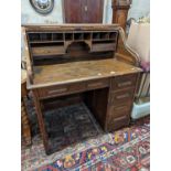An early 20th century oak roll top desk with 'S' shaped tambour, width 106cm, depth 75cm, height