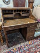 An early 20th century oak roll top desk with 'S' shaped tambour, width 106cm, depth 75cm, height