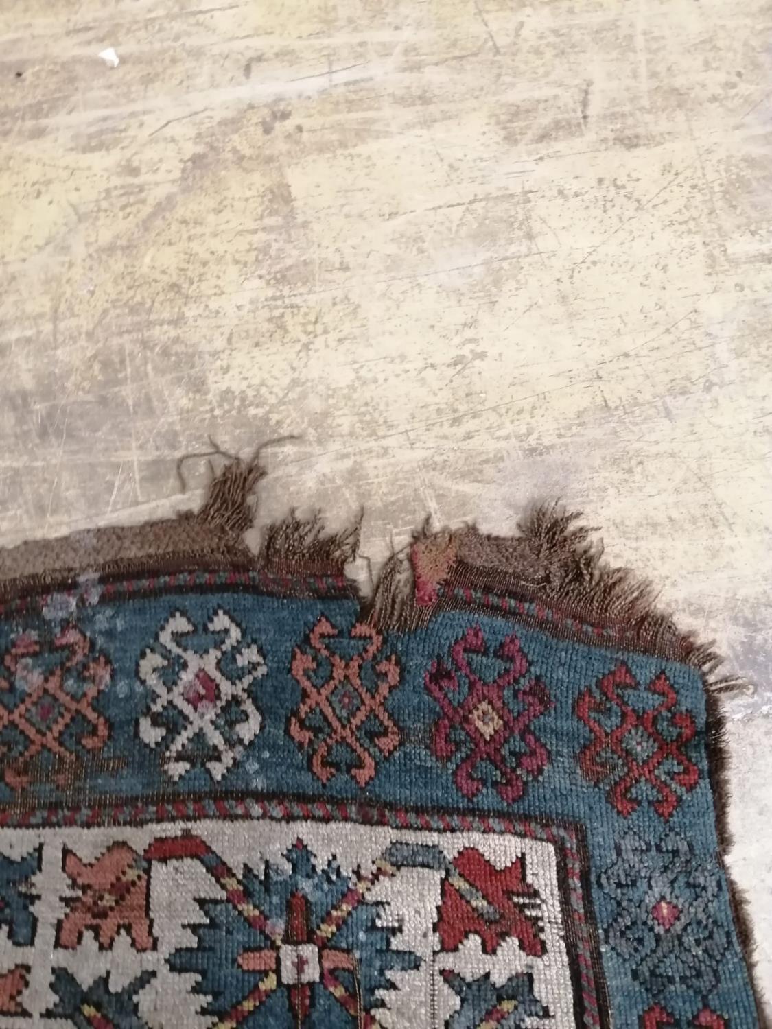 An antique Kazak rug, 310 x 150cm - Image 6 of 7
