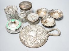 A silver and enamel mounted glass toilet jar, four other toilet jars, a hand mirror and three