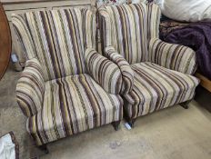 A pair of late Victorian Howard & Sons style armchairs, recently re-upholstered in a contemporary