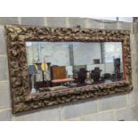 A 19th century carved giltwood rectangular wall mirror, width 140cm, height 76cm