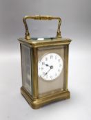 A French brass repeating carriage clock with key. 13.5cm