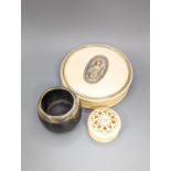 An early 19th century ivory circular box with central cartouche, a tortoiseshell match holder,