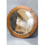 An Arts & Crafts circular copper mirror 56cm