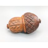 An early 19th century coquilla nut nutmeg grater, length 8cm