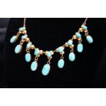 A 9k yellow metal and turquoise set drop fringe necklace, 43cm, gross 11.9 grams.