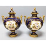 A pair of Coalport bird painted vases and covers, c.1900, inscribed Y.5146 - 22cm