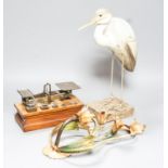 A Ratcliff weighing scale, a painted wrought iron floral wall light, a model of a stork, 33cm