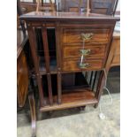 An Edwardian inlaid rosewood revolving bookcase fitted three drawers, width 52cm, depth 51cm, height