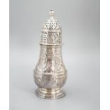 A George I silver sugar caster, with later? embossed decoration, Charles Adam, London, 1716, 13.5cm,