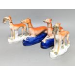 Two pairs of Staffordshire greyhounds, largest 19 cm long