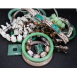 A group of bangles and necklaces including jade and agate.