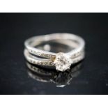 A yellow metal and single stone diamond ring, with diamond chip set split shoulders, size K, gross