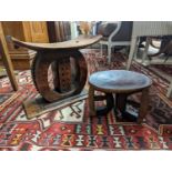 Two African carved hardwood stools, larger length 43cm, depth 19cm, height 37cm