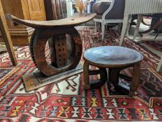 Two African carved hardwood stools, larger length 43cm, depth 19cm, height 37cm