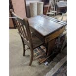 A vintage oak student's desk, width 57cm, depth 46cm, height 71cm with an elm and beech chair