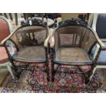 A pair of early 20th century Carolean style caned beech tub framed chairs, width 56cm, depth 48cm,