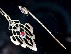 An Art Nouveau yellow metal and garnet set pendant,39mm, on a 9ct chain and a garnet and split pearl