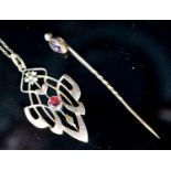 An Art Nouveau yellow metal and garnet set pendant,39mm, on a 9ct chain and a garnet and split pearl