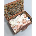 A 19th century German bisque-headed doll and three composition dolls
