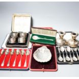 A cased pair of four 1920's silver napkin rings, four other cased items including butter shell and a