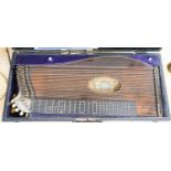 A cased J.Haslwanter guitar zither