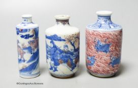 Three Chinese underglaze blue and copper red snuff bottles, 9cm