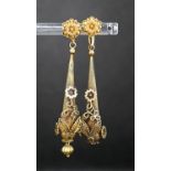 A pair of Victorian texture yellow metal pear shaped drop earrings, with star and foliate motifs(a.