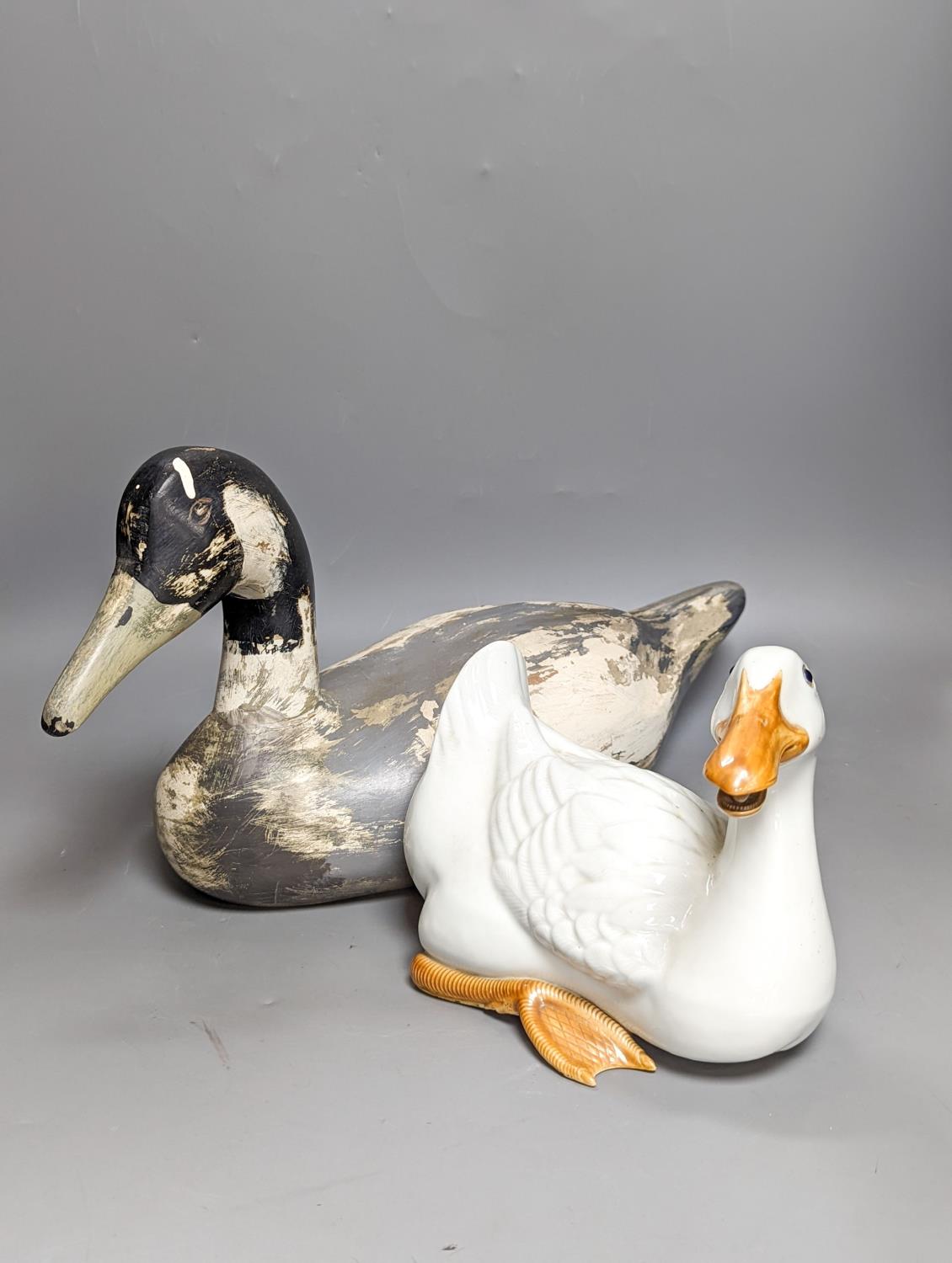 A modern painted decoy duck and a 20th century Chinese ceramic model duck (2) 42cm