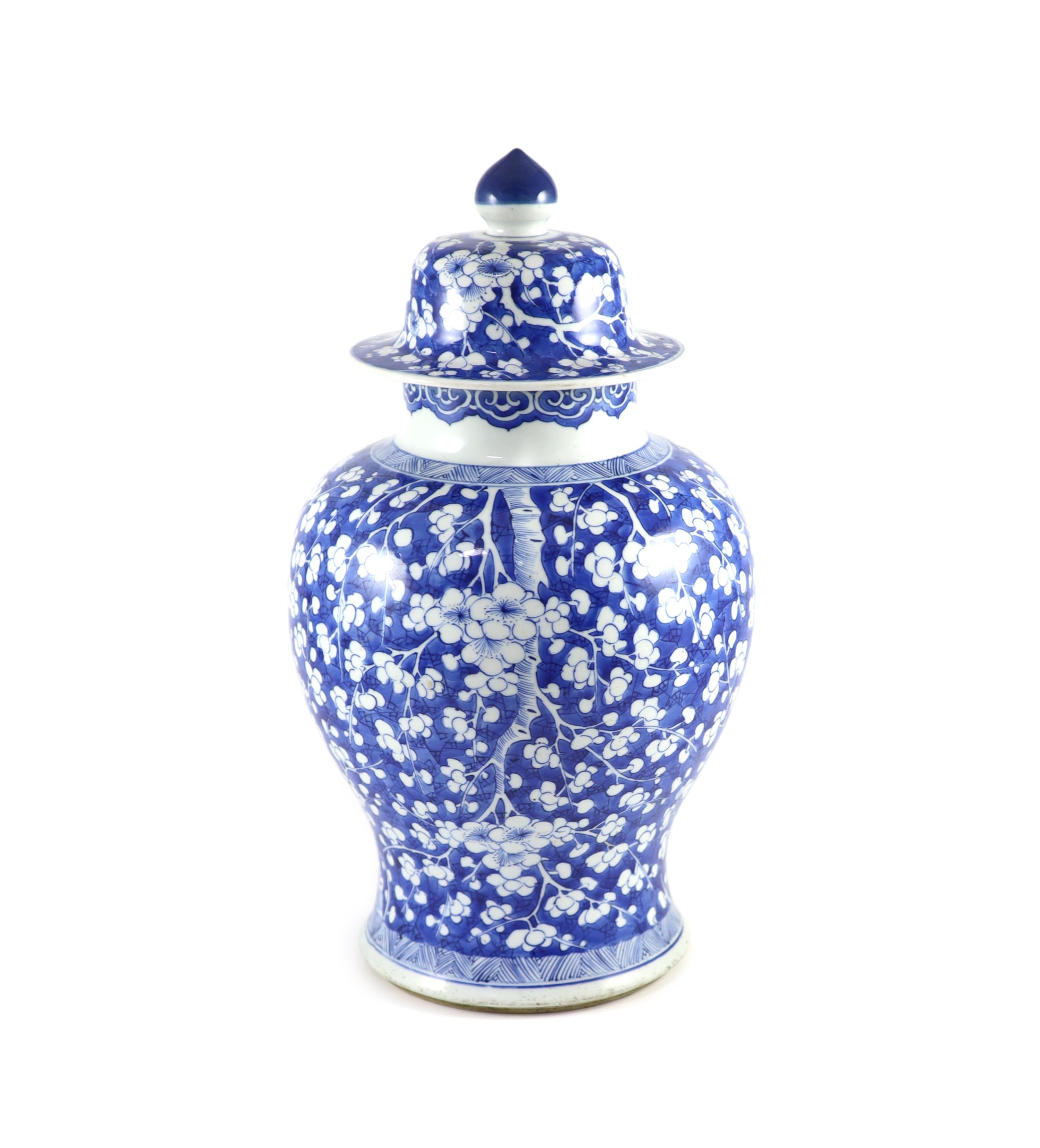 A good Chinese blue and white ‘prunus and cracked ice’ vase and cover, Kangxi period,with chevron