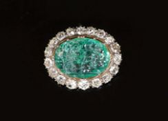 A possibly Roman oval intaglio emerald, mounted in an early Victorian gold, silver and diamond set