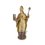 A 19th century German painted carved wood figure of St Ludgerus (b.742)standing holding a