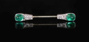 A 1930's/1940's French Cartier platinum, two stone cabochon emerald and four stone diamond set small